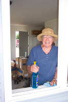 Volunteer with cleaning bottle