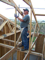 Worker working on joists