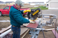Worker working with a saw