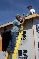 Workers working on a roof